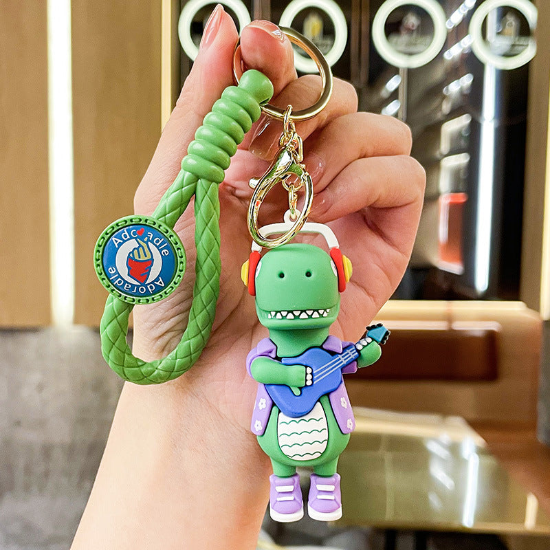 Wholesale New Creative Music Skateboard Dinosaur Doll Pvc Keychain